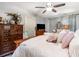 Bedroom featuring a ceiling fan, large bed, and dresser at 146 Stillwood Dr. # 3, Pawleys Island, SC 29585