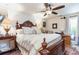 Bedroom with wooden furniture, ceiling fan, and side table at 146 Stillwood Dr. # 3, Pawleys Island, SC 29585
