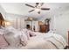 Bedroom with a ceiling fan, cozy bedding, and a view to the bathroom at 146 Stillwood Dr. # 3, Pawleys Island, SC 29585