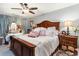 Cozy bedroom with a ceiling fan, plush bedding, and wooden furniture at 146 Stillwood Dr. # 3, Pawleys Island, SC 29585