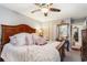 Bedroom featuring a large bed, ornate mirror, and spacious closet at 146 Stillwood Dr. # 3, Pawleys Island, SC 29585