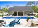 Backyard featuring a sparkling blue pool, inviting lounge chairs, and a cozy seating area at 1610 Old Tram Rd., Little River, SC 29566