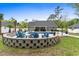 Backyard featuring a sparkling blue pool and a cozy fire pit area surrounded by seating at 1610 Old Tram Rd., Little River, SC 29566
