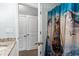 Bathroom with granite countertops and nautical themed shower curtain at 1610 Old Tram Rd., Little River, SC 29566