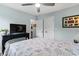 This spacious bedroom includes a large closet, a television, and neutral paint at 1610 Old Tram Rd., Little River, SC 29566