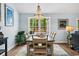 Dining room with large window and chandelier at 1610 Old Tram Rd., Little River, SC 29566