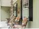 Cozy front porch with comfortable seating and decorative touches at 1610 Old Tram Rd., Little River, SC 29566