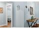 Hallway leading to bedroom with a decorative console table at 1610 Old Tram Rd., Little River, SC 29566
