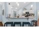 Bright kitchen with granite counters, breakfast bar, and blue accent walls at 1610 Old Tram Rd., Little River, SC 29566