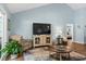 Bright living room with hardwood floors and vaulted ceilings at 1610 Old Tram Rd., Little River, SC 29566