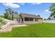 Large back yard with manicured lawn, patio and screened in porch at 1674 Sw Beach Dr., Calabash, SC 28467