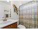 Bathroom featuring a sink with a wood vanity and a shower/tub combination at 1674 Sw Beach Dr., Calabash, SC 28467