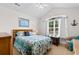 Cozy bedroom featuring natural light, light-colored walls, and a comfortable bed at 1674 Sw Beach Dr., Calabash, SC 28467