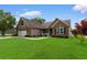 Charming home with brick and siding exterior, manicured lawn, and attached two-car garage at 1674 Sw Beach Dr., Calabash, SC 28467