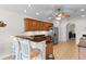 Kitchen featuring bar-style seating, granite countertops, stainless steel refrigerator, and tile floors at 1674 Sw Beach Dr., Calabash, SC 28467