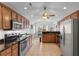 Spacious kitchen features stainless steel appliances, ample cabinetry, granite countertops, and tile floors at 1674 Sw Beach Dr., Calabash, SC 28467