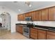 This kitchen features stainless steel appliances, plenty of cabinet space, and tile flooring at 1674 Sw Beach Dr., Calabash, SC 28467