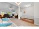 Open-concept living area with fireplace, tile accent, and comfortable furnishings at 1674 Sw Beach Dr., Calabash, SC 28467