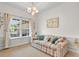 Comfortable living room with large window and stylish decor at 1674 Sw Beach Dr., Calabash, SC 28467