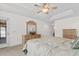 Bright primary bedroom showcasing natural light, neutral tones, and ample closet space at 1674 Sw Beach Dr., Calabash, SC 28467
