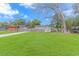 Spacious backyard featuring lush green grass, a wooden fence, and a storage shed at 1931 Jasper St., Georgetown, SC 29440