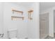 Updated bathroom with a toilet, shower, and shelving at 1931 Jasper St., Georgetown, SC 29440