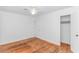 Spacious bedroom features hardwood floors, white walls, ceiling fan, and closet for storage at 1931 Jasper St., Georgetown, SC 29440