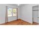Bright bedroom featuring hardwood floors, a window with natural light, and a closet at 1931 Jasper St., Georgetown, SC 29440