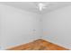 This bedroom features hardwood floors, white walls, a ceiling fan, and closet for storage at 1931 Jasper St., Georgetown, SC 29440