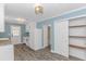 Well-lit kitchen with white cabinets, stainless appliances, and convenient access to an adjacent closet space at 1931 Jasper St., Georgetown, SC 29440