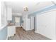 Bright kitchen featuring white cabinets, modern lighting, stainless appliances and wood-look flooring at 1931 Jasper St., Georgetown, SC 29440