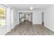 Open-concept living room with views of the kitchen, complemented by stylish floors and natural lighting at 1931 Jasper St., Georgetown, SC 29440