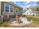 Backyard patio area featuring seating and a grill, ideal for outdoor dining and entertaining at 200 Stonefly Ct., Murrells Inlet, SC 29576