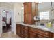 Bathroom featuring double vanity with granite countertop, cherry cabinets and a large mirror at 200 Stonefly Ct., Murrells Inlet, SC 29576