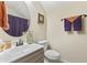 Bathroom featuring modern sink, mirror, and toilet, accented with colorful towels at 200 Stonefly Ct., Murrells Inlet, SC 29576