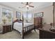 Charming bedroom with a four-poster bed, neutral walls, and natural light from two windows at 200 Stonefly Ct., Murrells Inlet, SC 29576