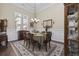 Elegant dining room featuring a chandelier, wainscoting, and a spacious table for gatherings at 200 Stonefly Ct., Murrells Inlet, SC 29576