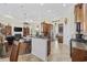 Open concept kitchen with granite counters, island with seating, dark cabinets, and stainless appliances at 200 Stonefly Ct., Murrells Inlet, SC 29576