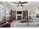 Bright living room with a fireplace, built-in shelving, and comfortable seating, perfect for relaxation at 200 Stonefly Ct., Murrells Inlet, SC 29576