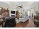 Open-concept living room with fireplace, built-in shelves, and hardwood floors at 200 Stonefly Ct., Murrells Inlet, SC 29576