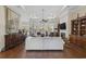 Spacious living room with hardwood floors, fireplace, and large windows offering abundant natural light at 200 Stonefly Ct., Murrells Inlet, SC 29576