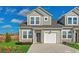 Charming two-story townhome with a one car garage, landscaped front yard, and a concrete driveway at 2107 Victory Way # 496, Myrtle Beach, SC 29579