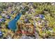 Aerial view of a lot near water, surrounded by large luxury homes and a private pond at 2208 Bentbill Circle, North Myrtle Beach, SC 29582