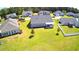 Aerial view of a home with lush green lawn, tidy landscaping, and a covered patio in a residential neighborhood at 240 Hillsborough Dr., Conway, SC 29526