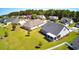 Aerial view of a backyard featuring a covered patio and lush green space perfect for outdoor relaxation and entertainment at 240 Hillsborough Dr., Conway, SC 29526
