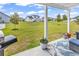 Backyard view from covered patio highlighting spacious lawn and neighborhood setting at 240 Hillsborough Dr., Conway, SC 29526