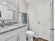 Clean bathroom featuring a granite countertop vanity, brushed nickel fixtures, and crisp white door at 240 Hillsborough Dr., Conway, SC 29526