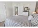 Cozy bedroom with stylish bedding, natural light, and a view into another room at 240 Hillsborough Dr., Conway, SC 29526