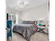 Comfortable bedroom with a ceiling fan, large window, and coordinating decor at 240 Hillsborough Dr., Conway, SC 29526