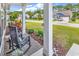 Inviting front porch featuring classic rocking chairs and manicured landscaping, perfect for relaxing outdoors at 240 Hillsborough Dr., Conway, SC 29526